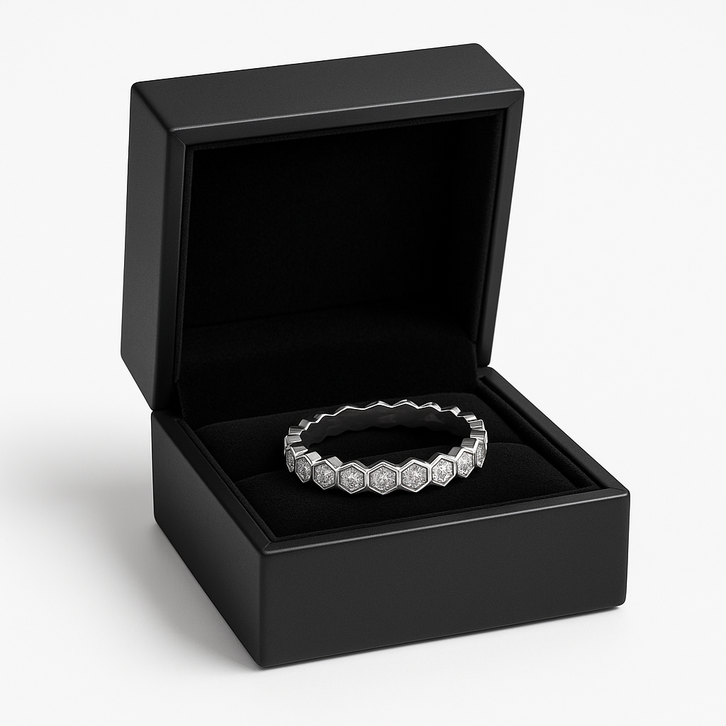 Silver ring n a black jewelry box on a white background