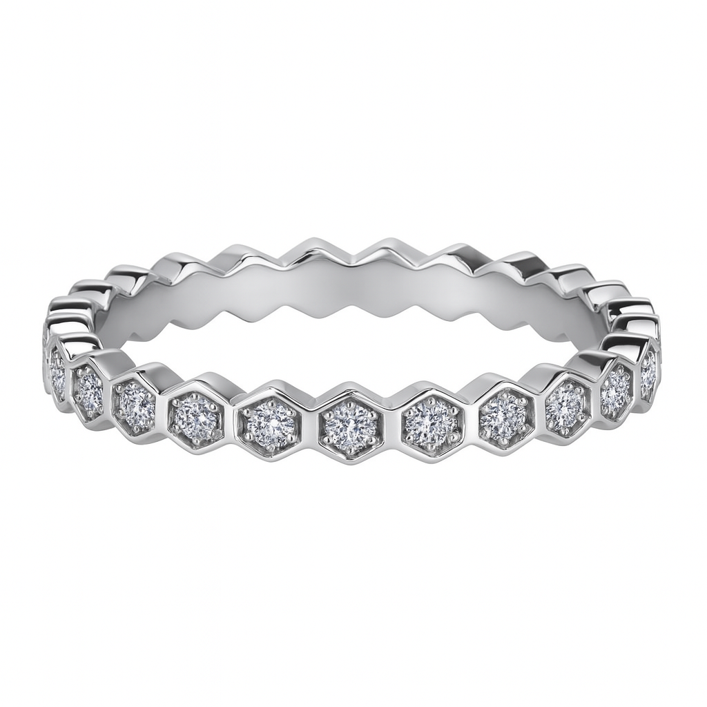 Silver ring with diamond accents on a white background